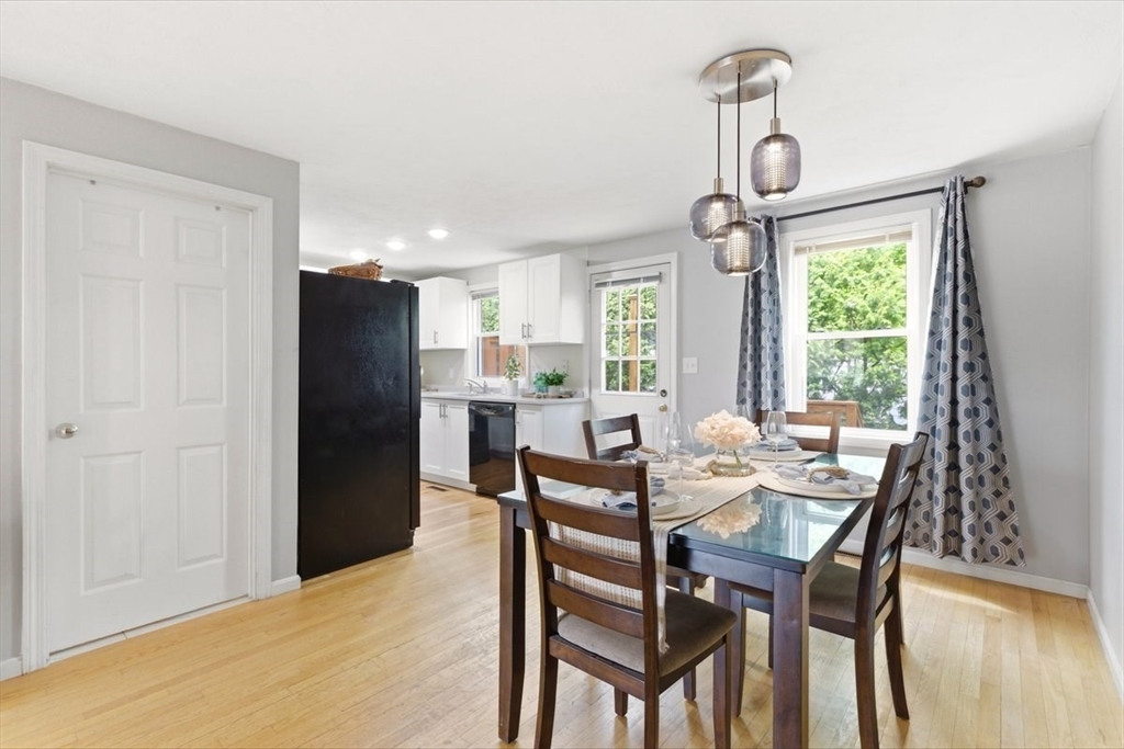 149 Bolivar Street, Unit B2 Canton, MA 02021 - Photo 12 of 34 a view of a dining room with furniture window and wooden floor