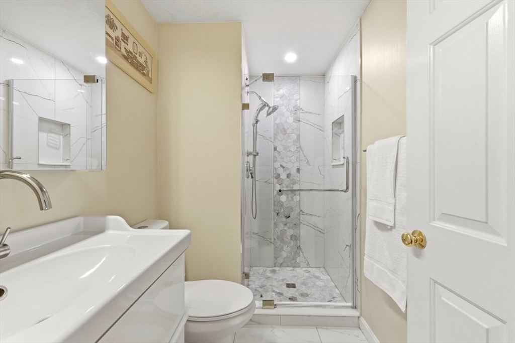 149 Bolivar Street, Unit B2 Canton, MA 02021 - Photo 13 of 34 a bathroom with a sink a toilet and shower