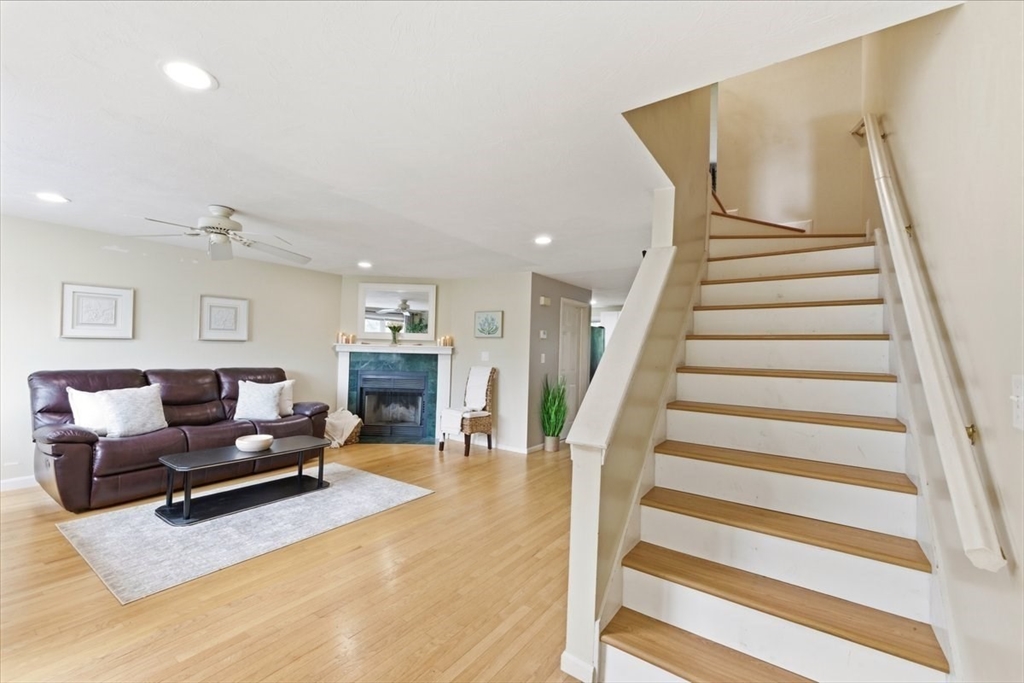 149 Bolivar Street, Unit B2 Canton, MA 02021 - Photo 15 of 34 a living room with furniture and a chandelier