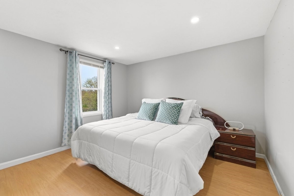 149 Bolivar Street, Unit B2 Canton, MA 02021 - Photo 16 of 34 a bedroom with a bed and a window