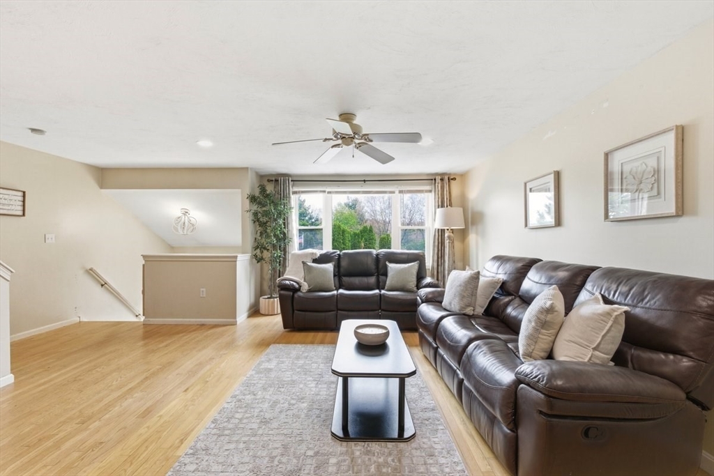 149 Bolivar Street, Unit B2 Canton, MA 02021 - Photo 6 of 34 a living room with furniture and a large window