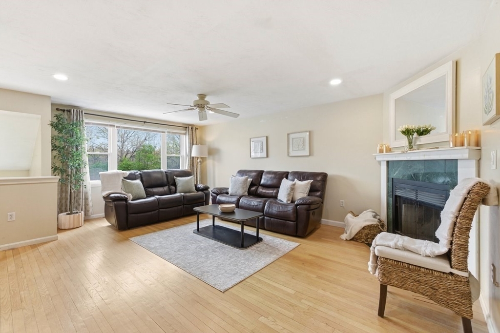 149 Bolivar Street, Unit B2 Canton, MA 02021 - Photo 7 of 34 a living room with furniture and a fireplace
