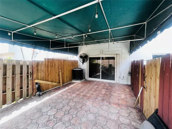 a view of living room with furniture and a large window