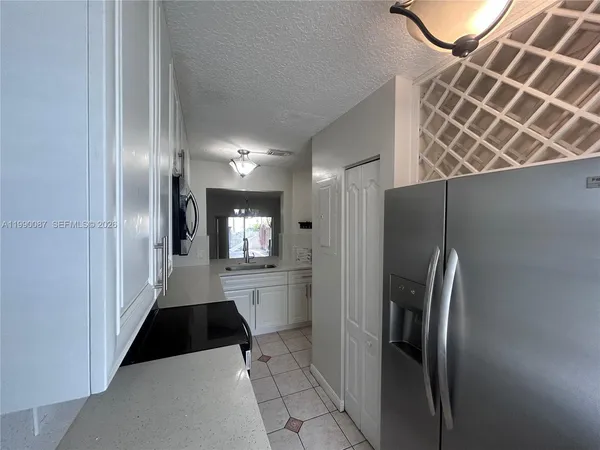 a kitchen with stainless steel appliances a refrigerator and a sink