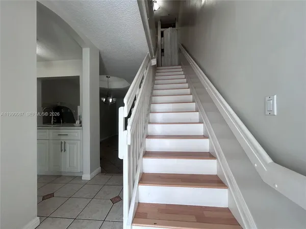 a view of entryway and hall with a living room