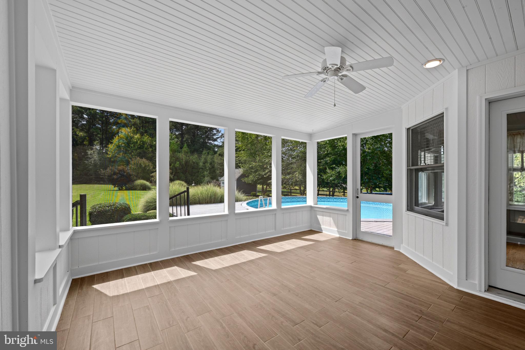 113 Bentons Pleasure Road Chester, MD 21619 - Photo 27 of 53 Bright sunroom with serene pool views.