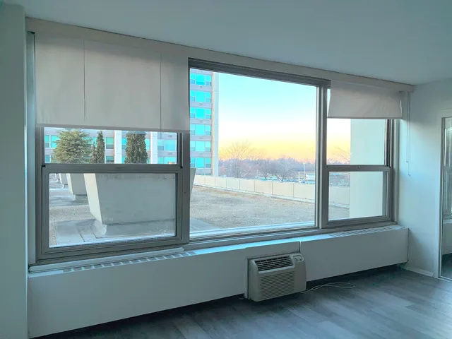 a view of a room with window an outdoor space