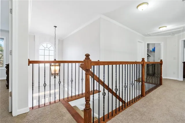 a view of a hallway view with staircase