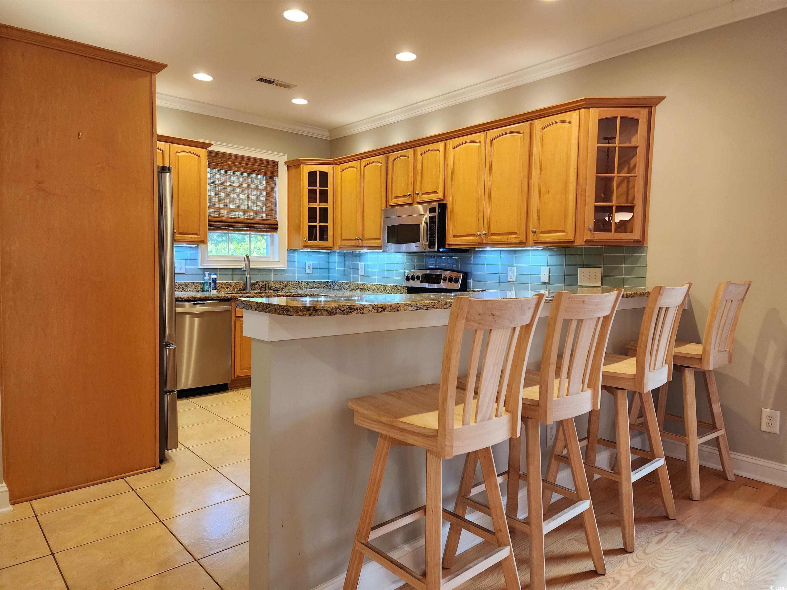 613 A Golden Bear Drive, Unit WOOD STORY LANDING PAWL Pawleys Island, SC 29585 - Photo 8 of 36