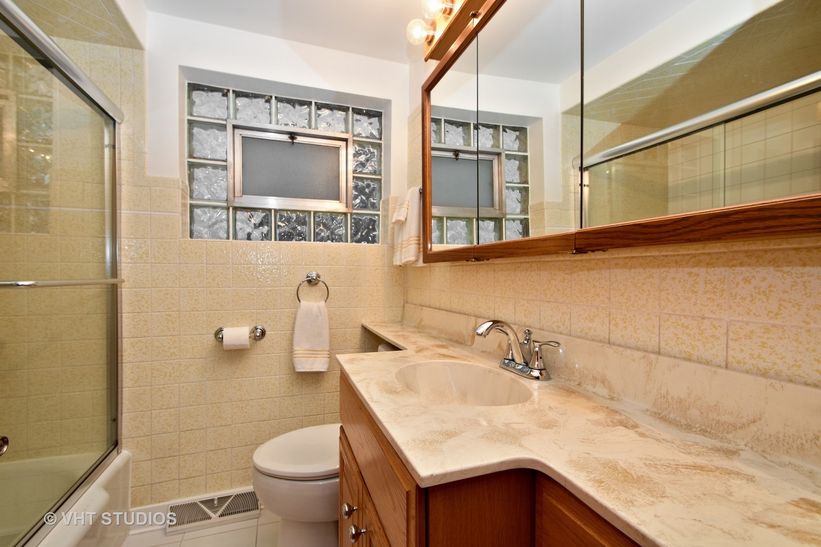 5155 South Mobile Avenue Chicago, IL 60638 - Photo 9 of 10 a bathroom with a granite countertop sink toilet and shower