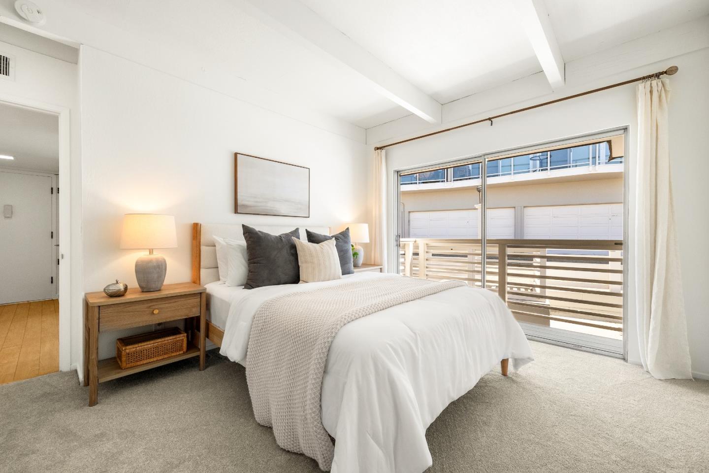 230 Rio Del Mar Boulevard, Unit K Aptos, CA 95003 - Photo 14 of 29 a spacious bedroom with a bed and a window