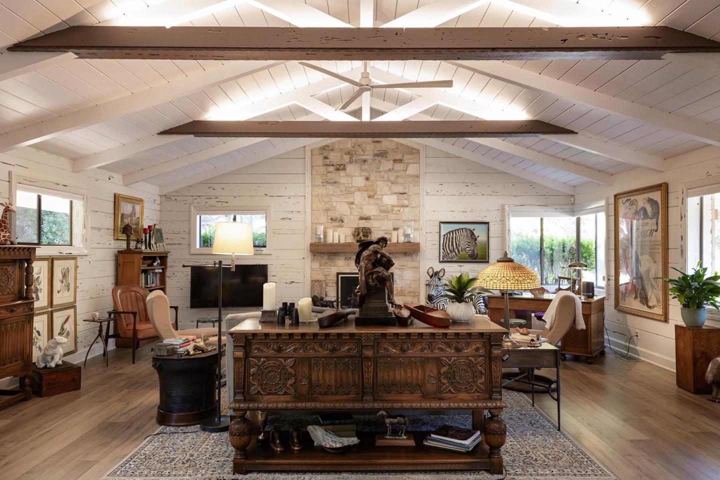 2 A La Rancheria Carmel Valley, CA 93924 - Photo 11 of 46 a living room with furniture a flat screen tv and floor to ceiling window