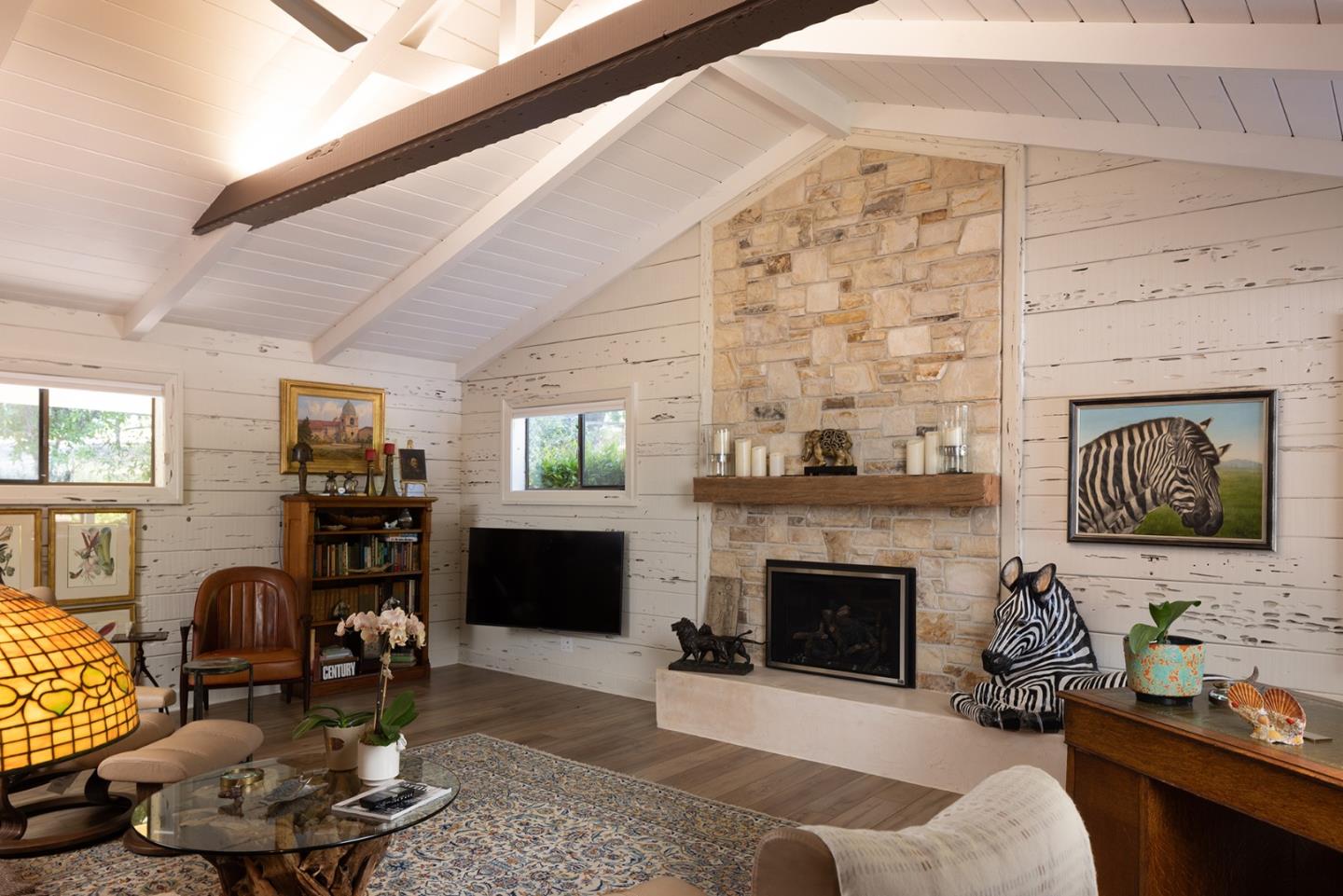 2 A La Rancheria Carmel Valley, CA 93924 - Photo 12 of 46 a living room with furniture a fireplace and a flat screen tv
