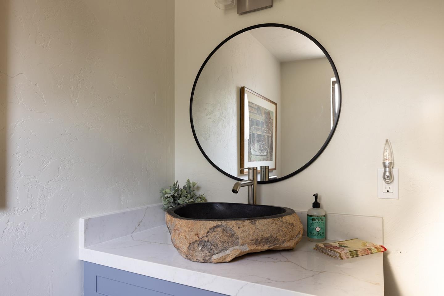 2 A La Rancheria Carmel Valley, CA 93924 - Photo 17 of 46 a living room with a mirror and a potted plant