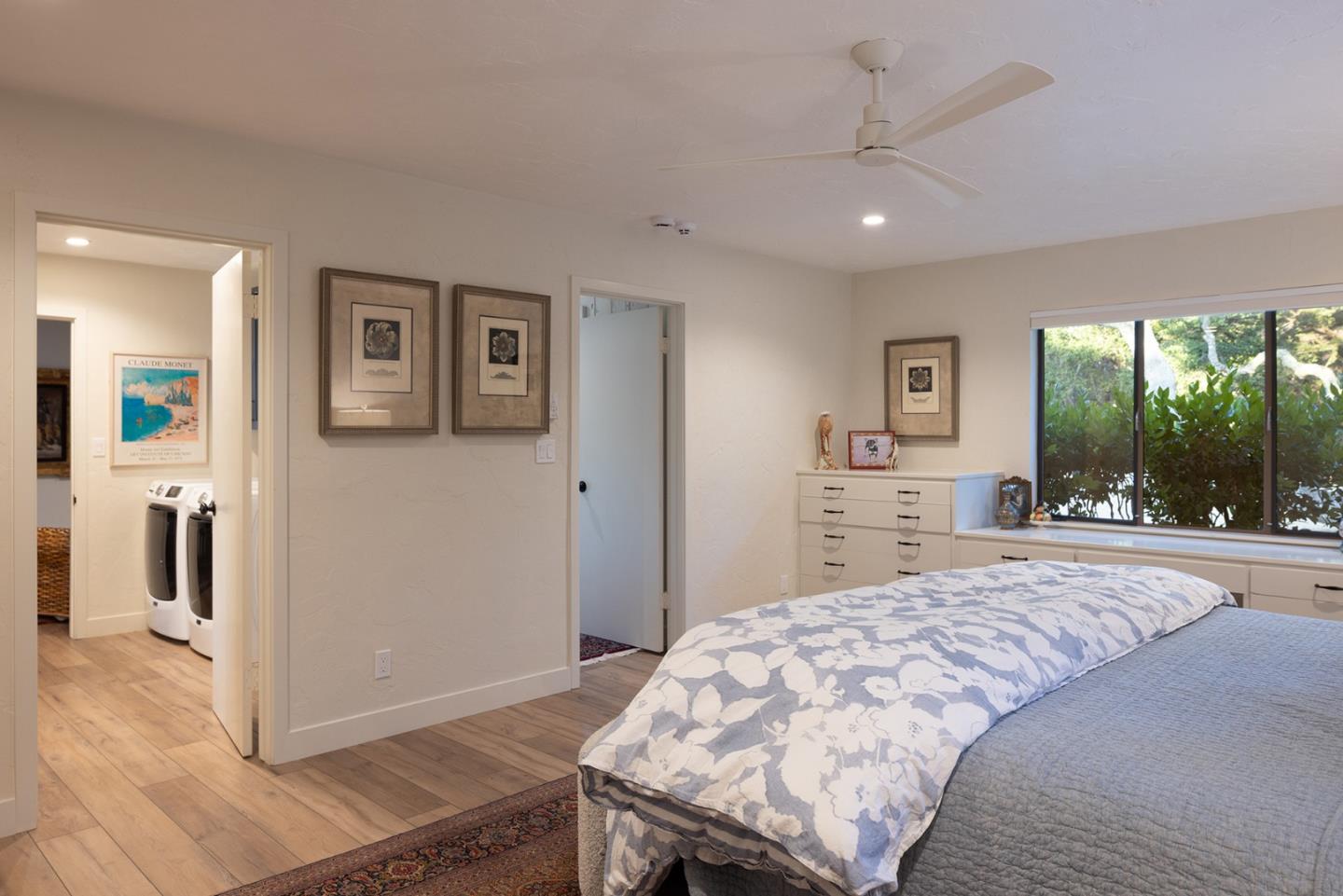2 A La Rancheria Carmel Valley, CA 93924 - Photo 22 of 46 a spacious bedroom with a bed and a large window