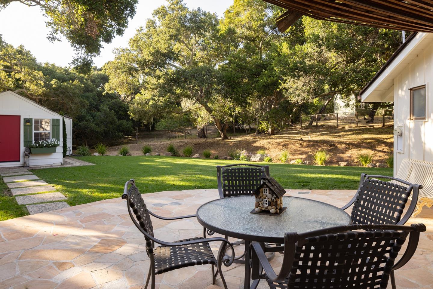 2 A La Rancheria Carmel Valley, CA 93924 - Photo 28 of 46 a view of a patio with table and chairs potted plants with wooden floor and fence