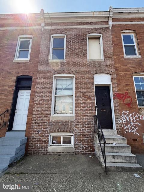 528 South Catherine Street Baltimore, MD 21223 - Photo 3 of 12 a front view of a building with stairs
