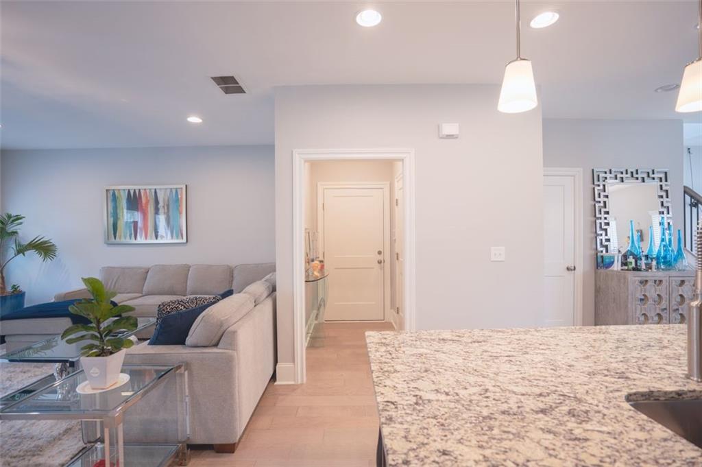 Undisclosed Address Atlanta, GA 30318 - Photo 13 of 19 a living room with furniture and a flat screen tv