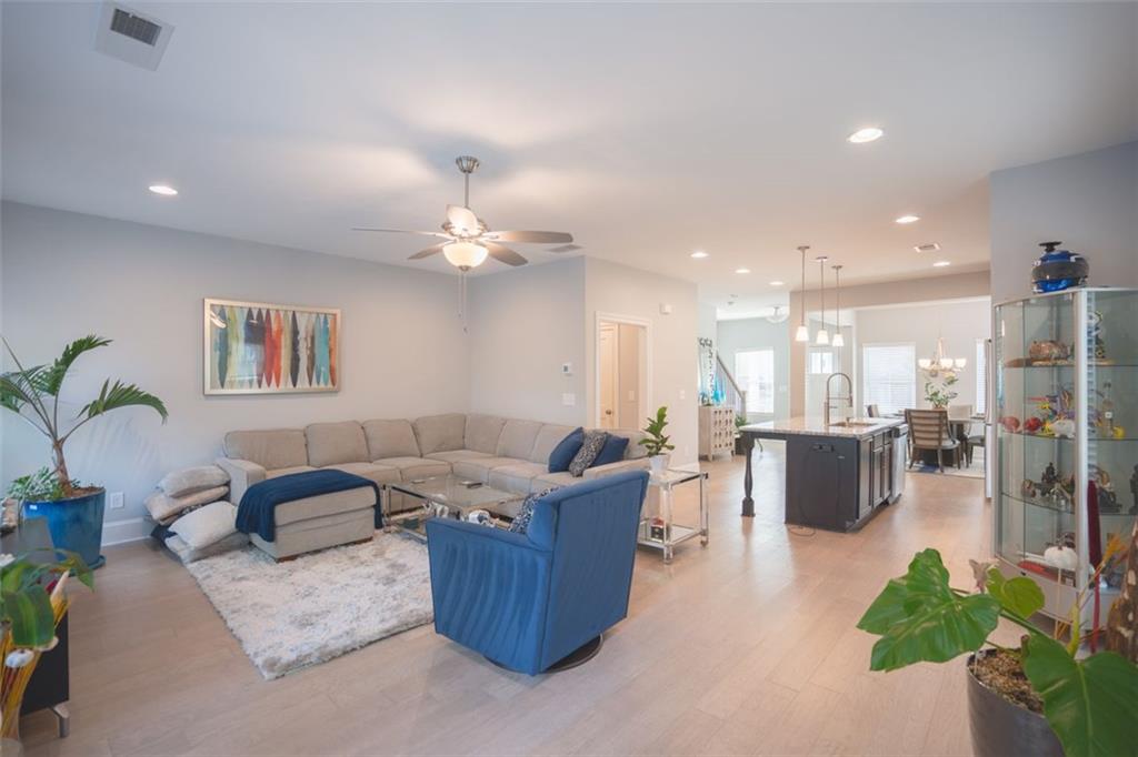 Undisclosed Address Atlanta, GA 30318 - Photo 15 of 19 a living room with furniture and a potted plant