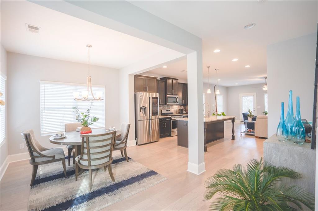 Undisclosed Address Atlanta, GA 30318 - Photo 6 of 19 a living room with furniture and kitchen view