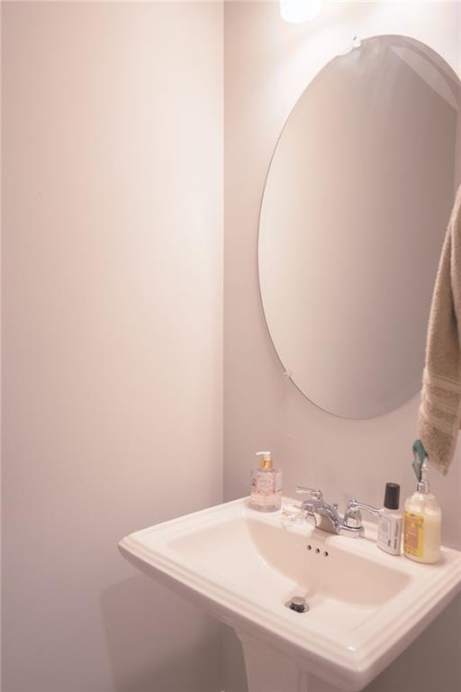 Undisclosed Address Atlanta, GA 30318 - Photo 10 of 19 a bathroom with a sink and a mirror