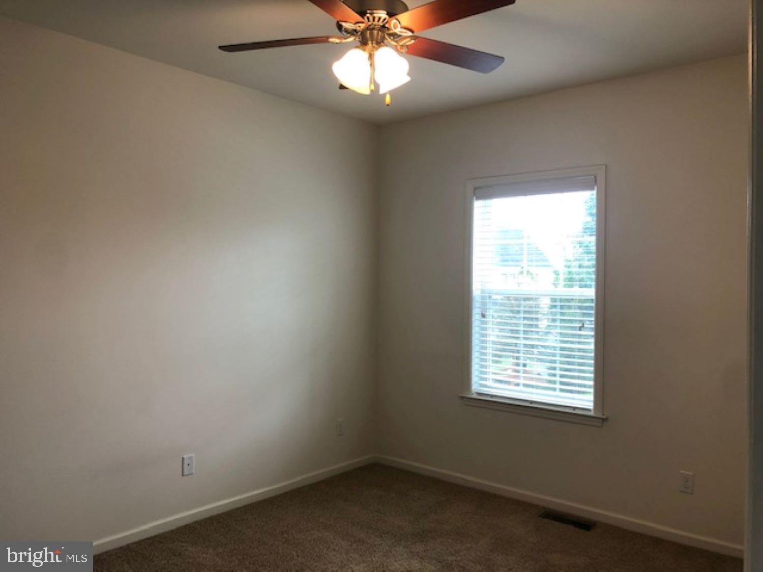 525 Hometowne Terrace Lititz, PA 17543 - Photo 5 of 11 an empty room with a window and a fan