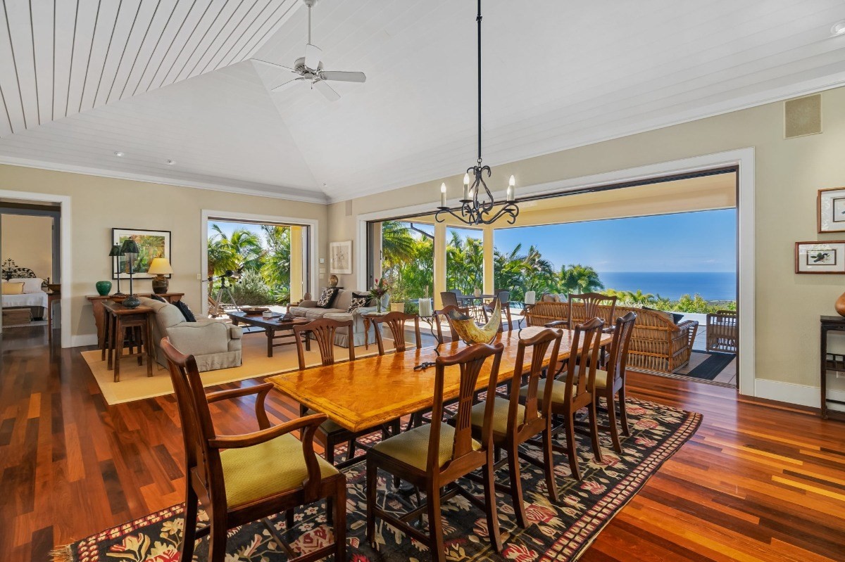 1050 F Puu Road, Unit 1 Kalaheo, HI 96741 - Photo 11 of 25 a view of a dining room with furniture window and wooden floor