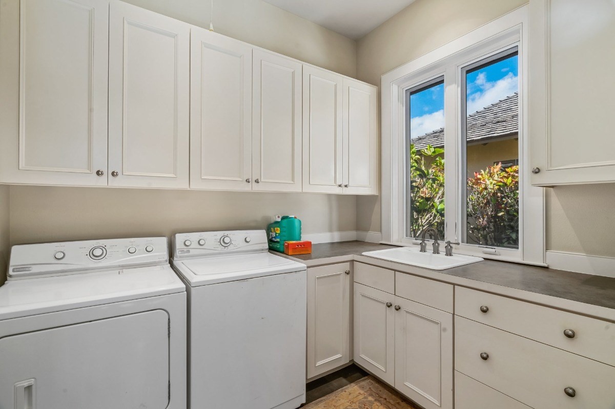 1050 F Puu Road, Unit 1 Kalaheo, HI 96741 - Photo 17 of 25 a view of cabinets a sink and a window in the kitchen