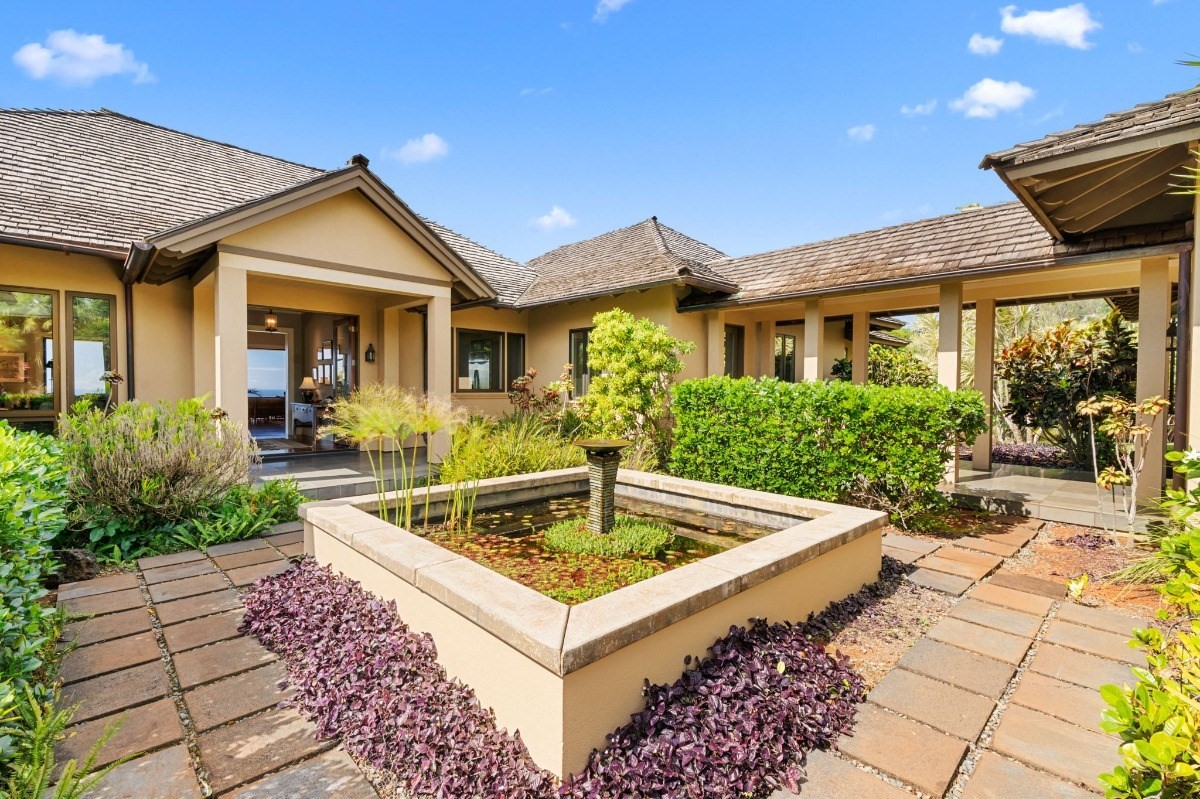 1050 F Puu Road, Unit 1 Kalaheo, HI 96741 - Photo 2 of 25 a view of house and a yard with a fountain