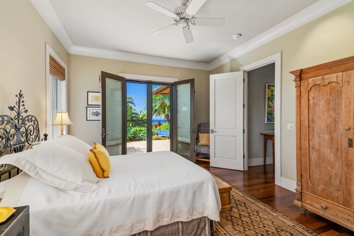 1050 F Puu Road, Unit 1 Kalaheo, HI 96741 - Photo 21 of 25 a bedroom with a bed and a dresser