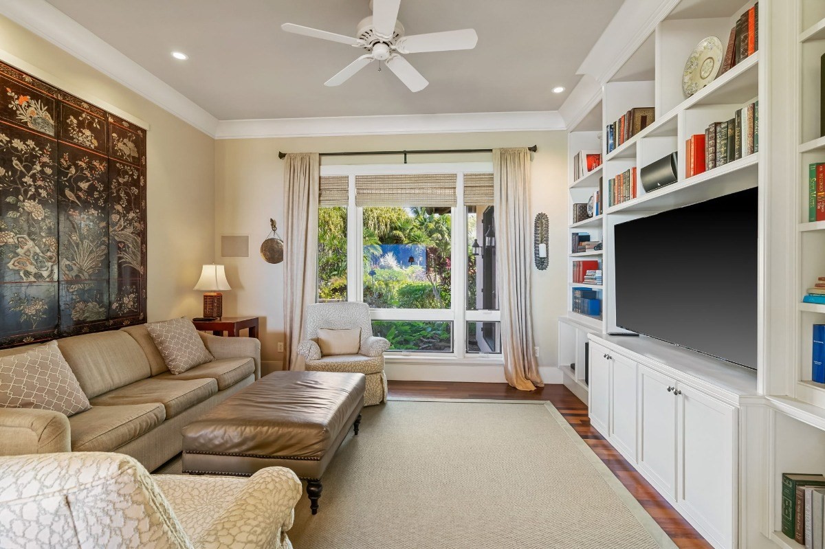 1050 F Puu Road, Unit 1 Kalaheo, HI 96741 - Photo 23 of 25 a living room with furniture and a flat screen tv