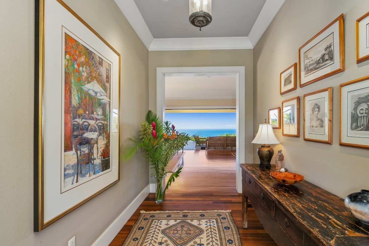 1050 F Puu Road, Unit 1 Kalaheo, HI 96741 - Photo 4 of 25 a living room with furniture and a potted plant