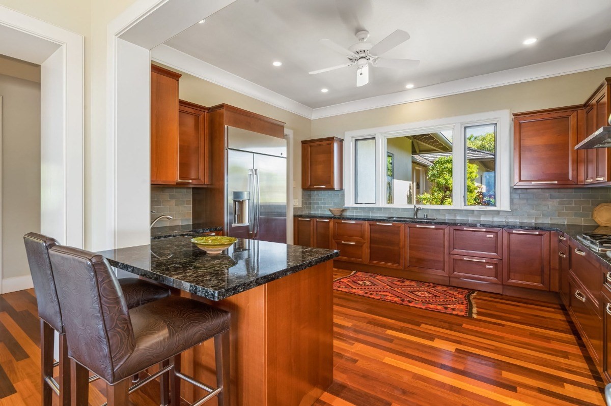 1050 F Puu Road, Unit 1 Kalaheo, HI 96741 - Photo 9 of 25 a kitchen with granite countertop lots of counter top space and furniture
