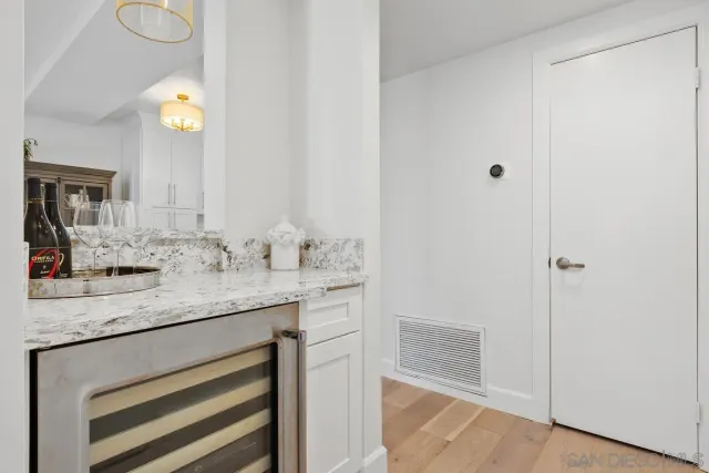a bathroom with a bathtub shower sink vanity and mirror