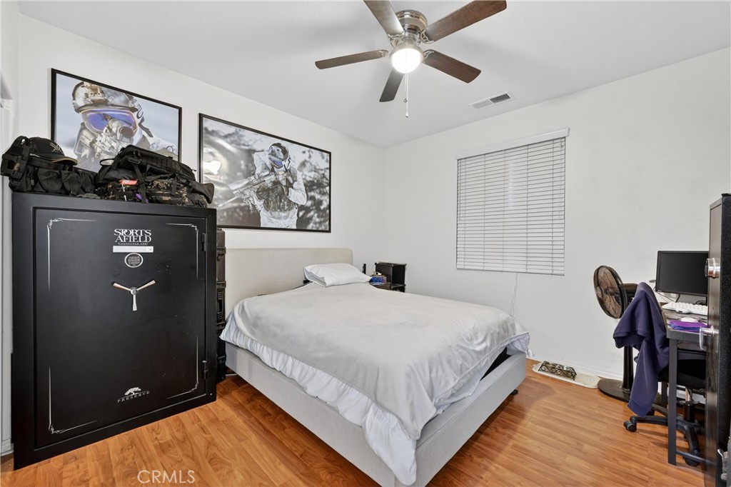 34581 Spindle Tree Street Winchester, CA 92596 - Photo 11 of 50 a bedroom with double bed and a window