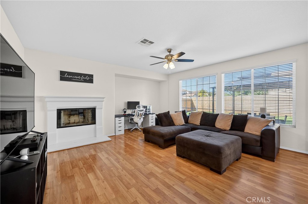 34581 Spindle Tree Street Winchester, CA 92596 - Photo 18 of 50 a living room with furniture and a fireplace