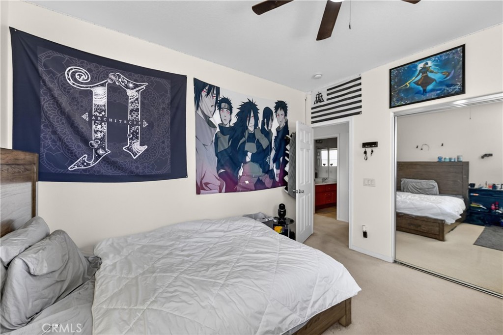 34581 Spindle Tree Street Winchester, CA 92596 - Photo 32 of 50 a bedroom with a bed and wall painting