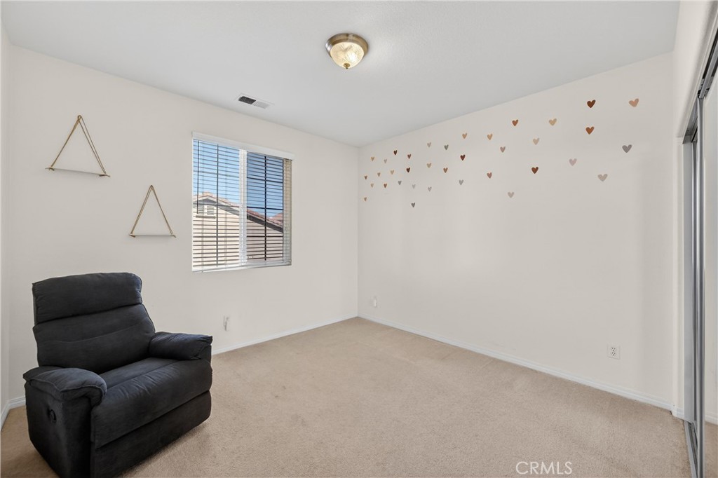 34581 Spindle Tree Street Winchester, CA 92596 - Photo 33 of 50 a livingroom with furniture and a window