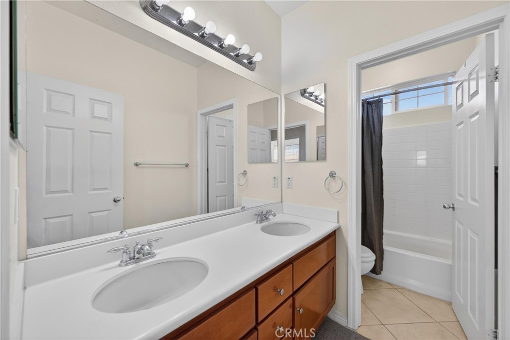 34581 Spindle Tree Street Winchester, CA 92596 - Photo 35 of 50 a bathroom with a sink double vanity granite tub and shower