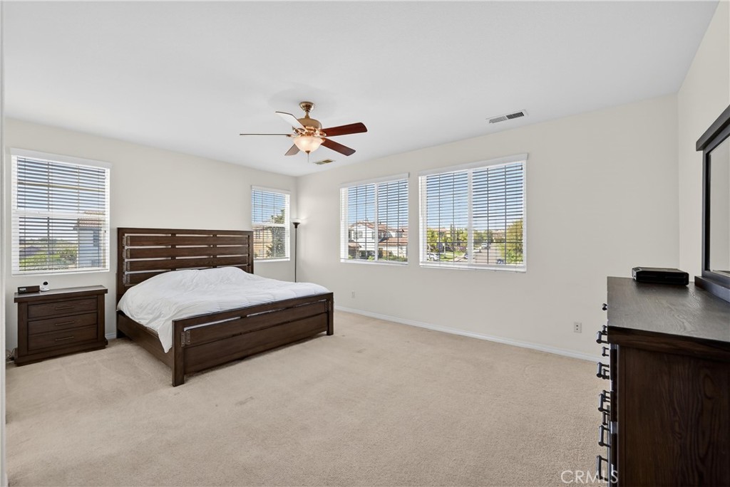 34581 Spindle Tree Street Winchester, CA 92596 - Photo 38 of 50 a bedroom with a bed window and a table