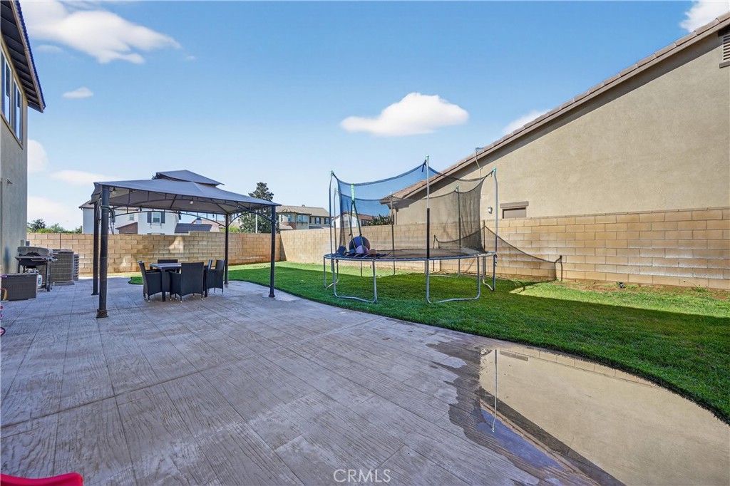 34581 Spindle Tree Street Winchester, CA 92596 - Photo 44 of 50 a view of a house with backyard and porch
