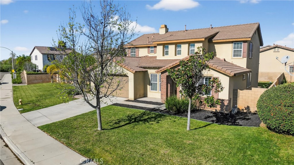 34581 Spindle Tree Street Winchester, CA 92596 - Photo 6 of 50 a white house that has a tree in front of it