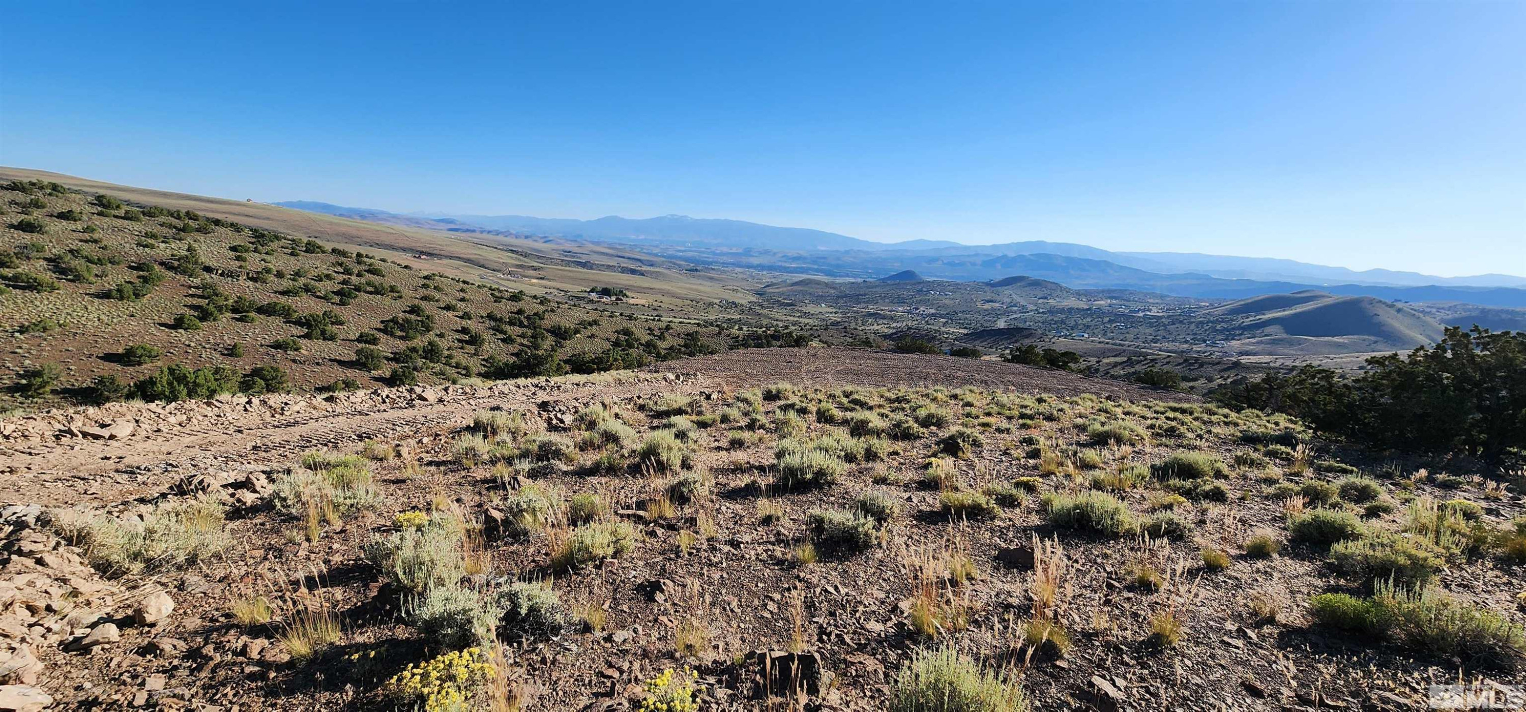 0 Curnow Canyon Road Sparks, NV 89441 - Photo 14 of 19 a view of a large mountain with mountains in the background