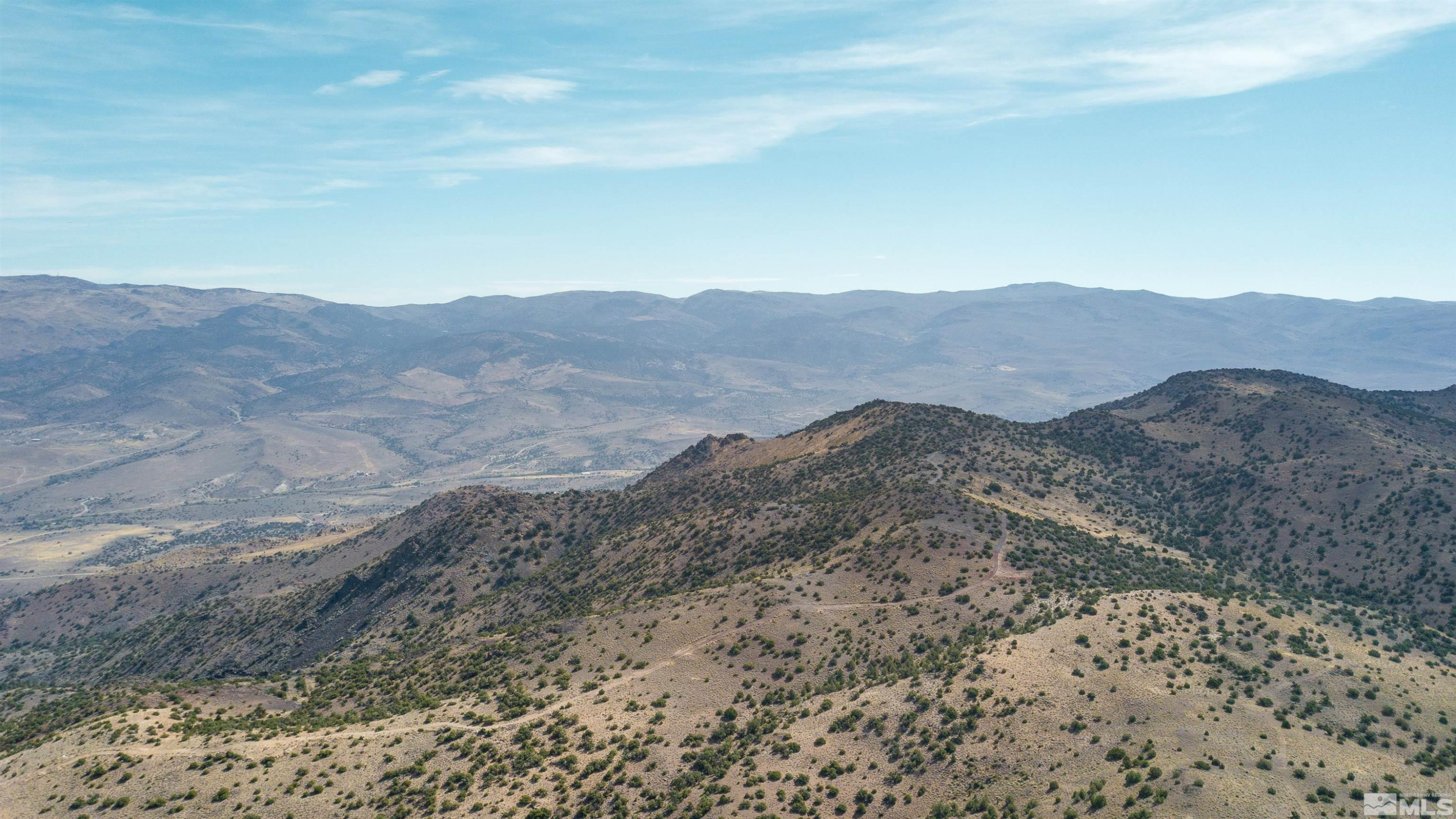 0 Curnow Canyon Road Sparks, NV 89441 - Photo 5 of 19 a view of a mountain range with a lush green hillside