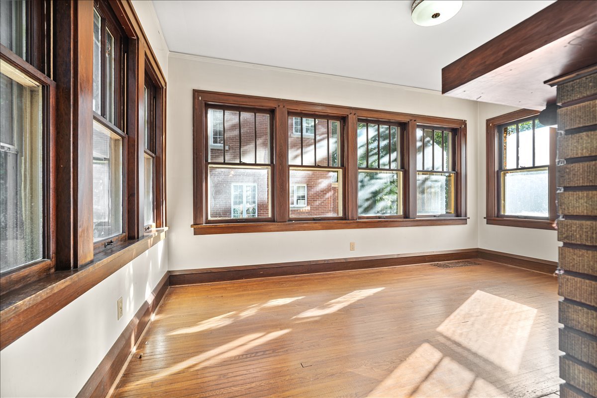 713 Normal Avenue Normal, IL 61761 - Photo 11 of 43 a view of an empty room with a window and a kitchen