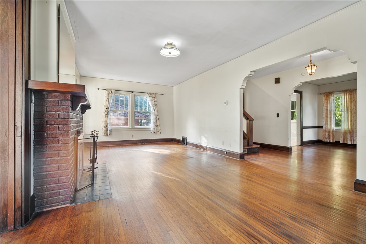 713 Normal Avenue Normal, IL 61761 - Photo 14 of 43 a view of a livingroom with wooden floor and a window