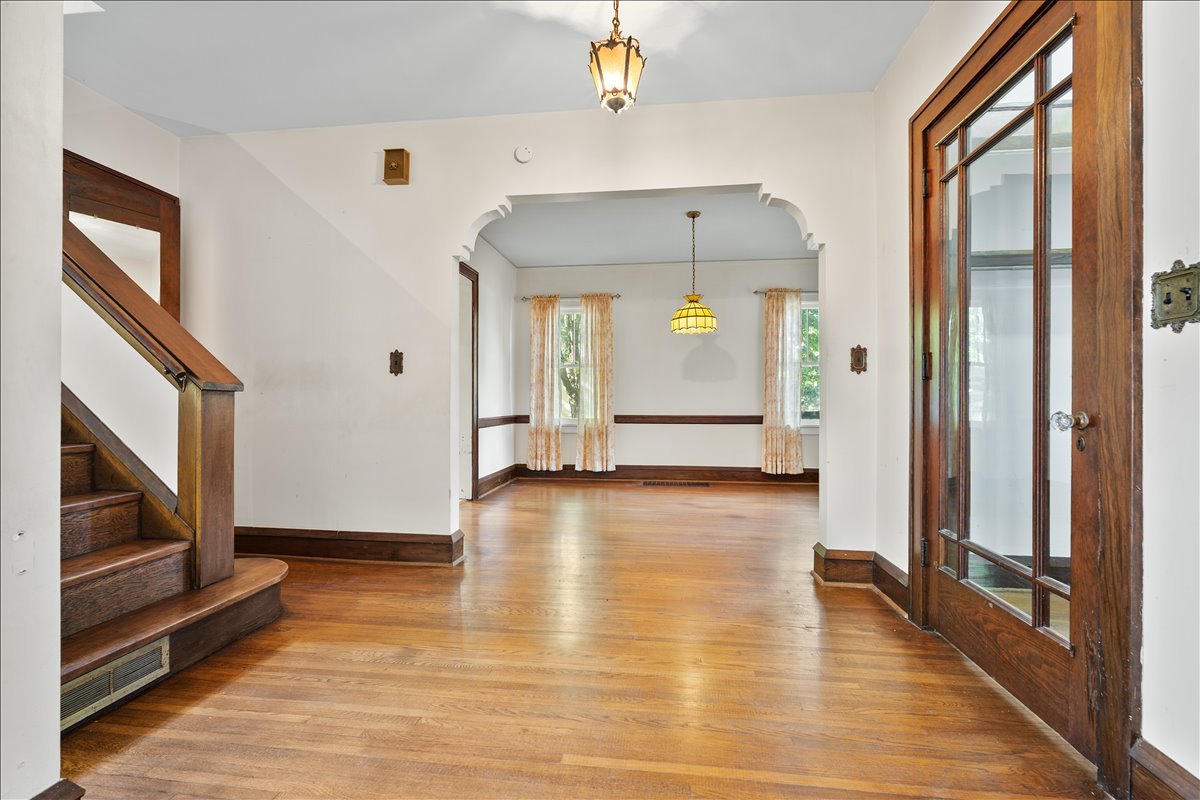 713 Normal Avenue Normal, IL 61761 - Photo 15 of 43 a view of a hallway view with wooden floor and staircase