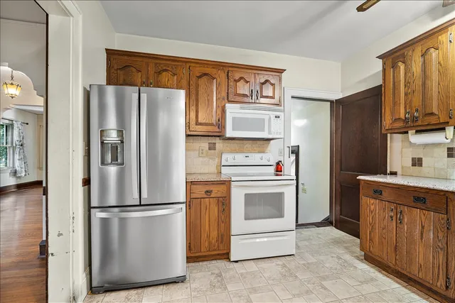 a kitchen with stainless steel appliances a refrigerator stove and sink