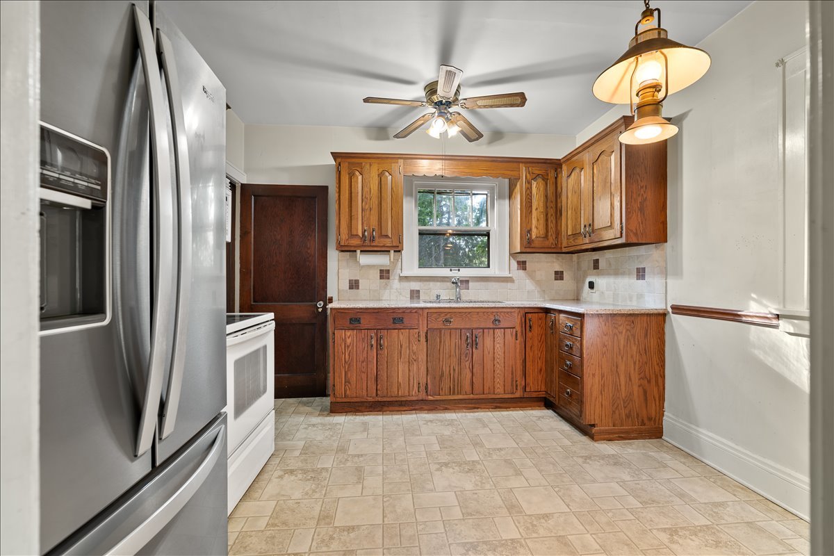 713 Normal Avenue Normal, IL 61761 - Photo 2 of 43 a kitchen with stainless steel appliances a refrigerator sink and cabinets