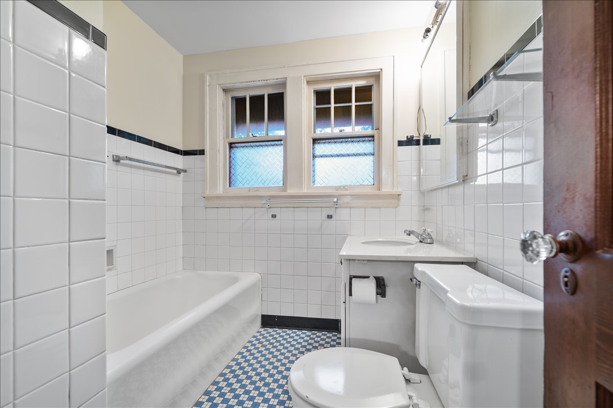 713 Normal Avenue Normal, IL 61761 - Photo 22 of 43 a bathroom with a sink toilet and shower